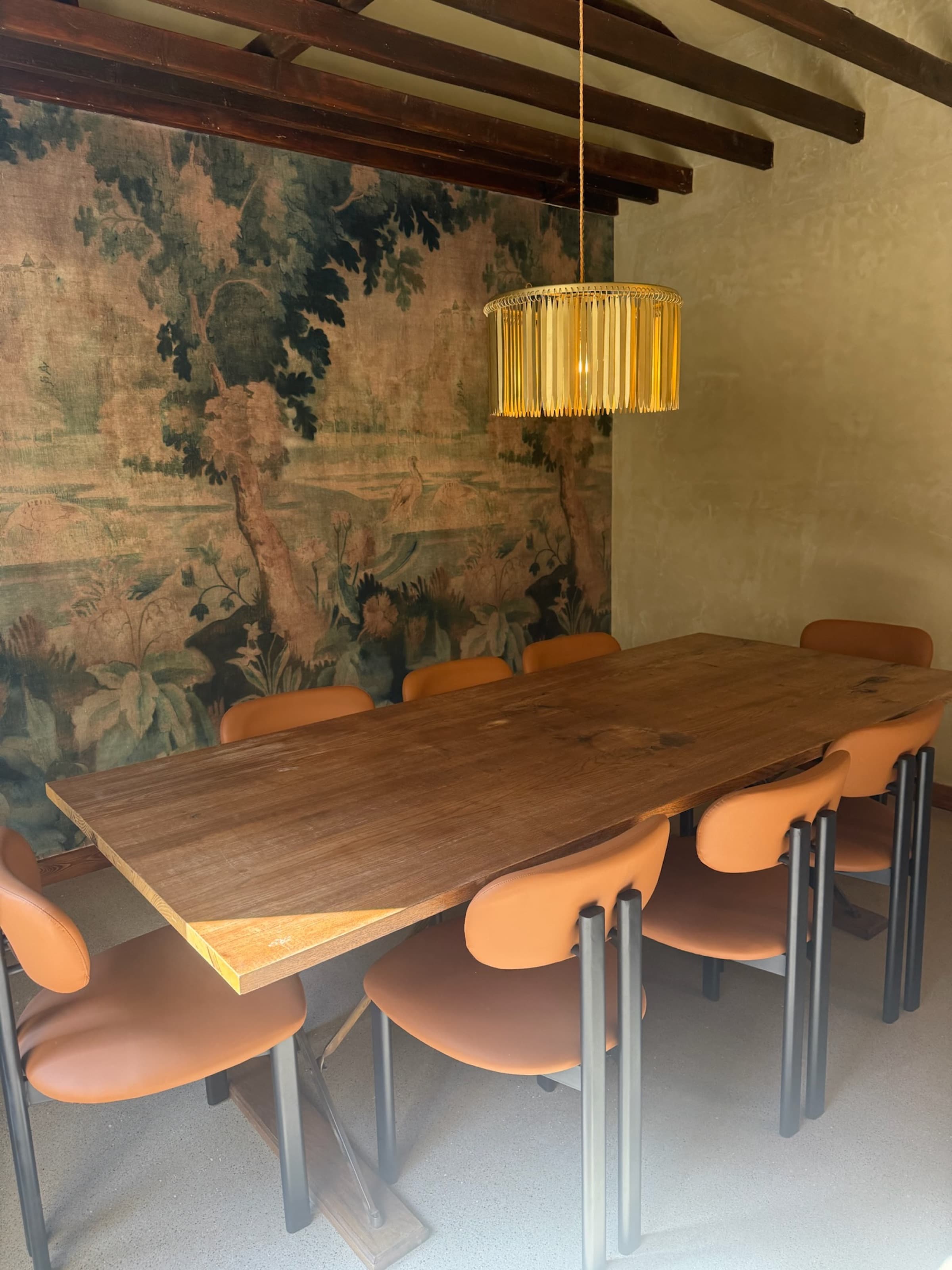 Tapestry dining room, long table, pendant, exposed beams
