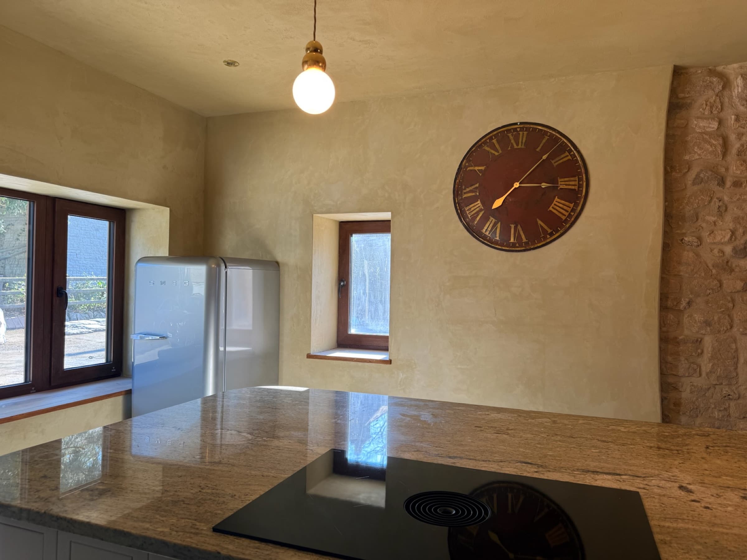 Kitchen, stone wall, Smeg fridge, marble worktop