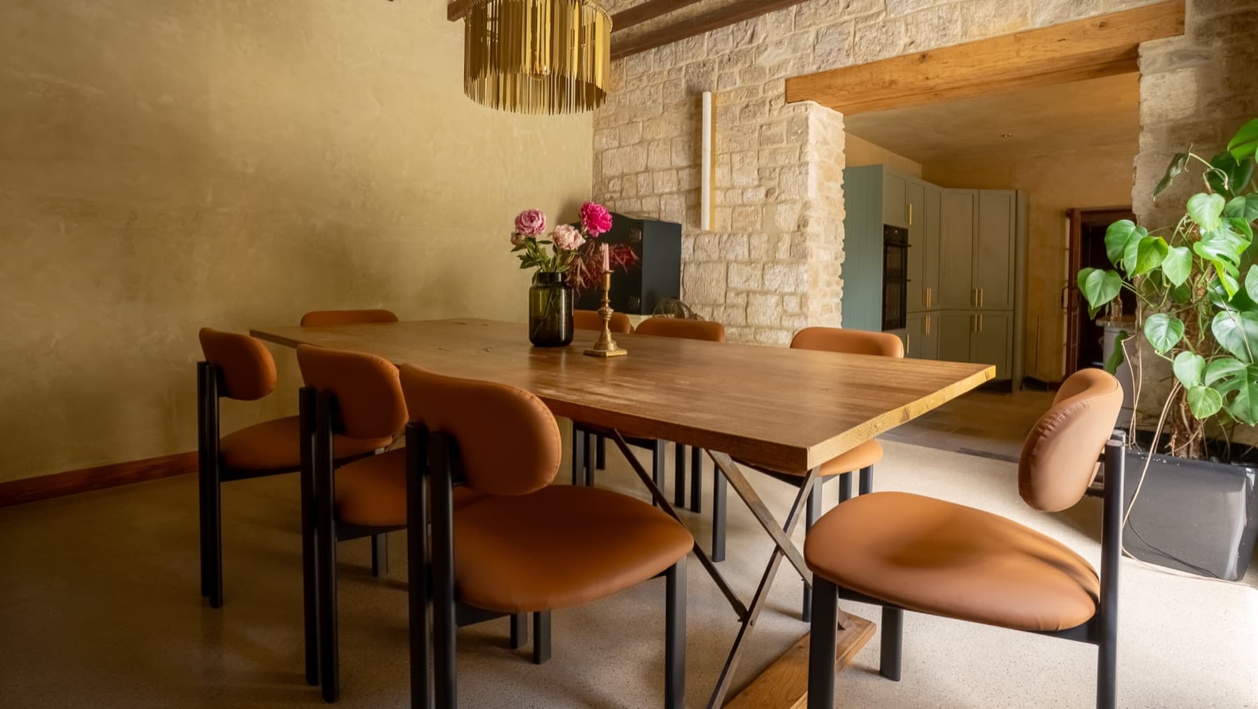 Tapestry dining room, walnut table and stone arches