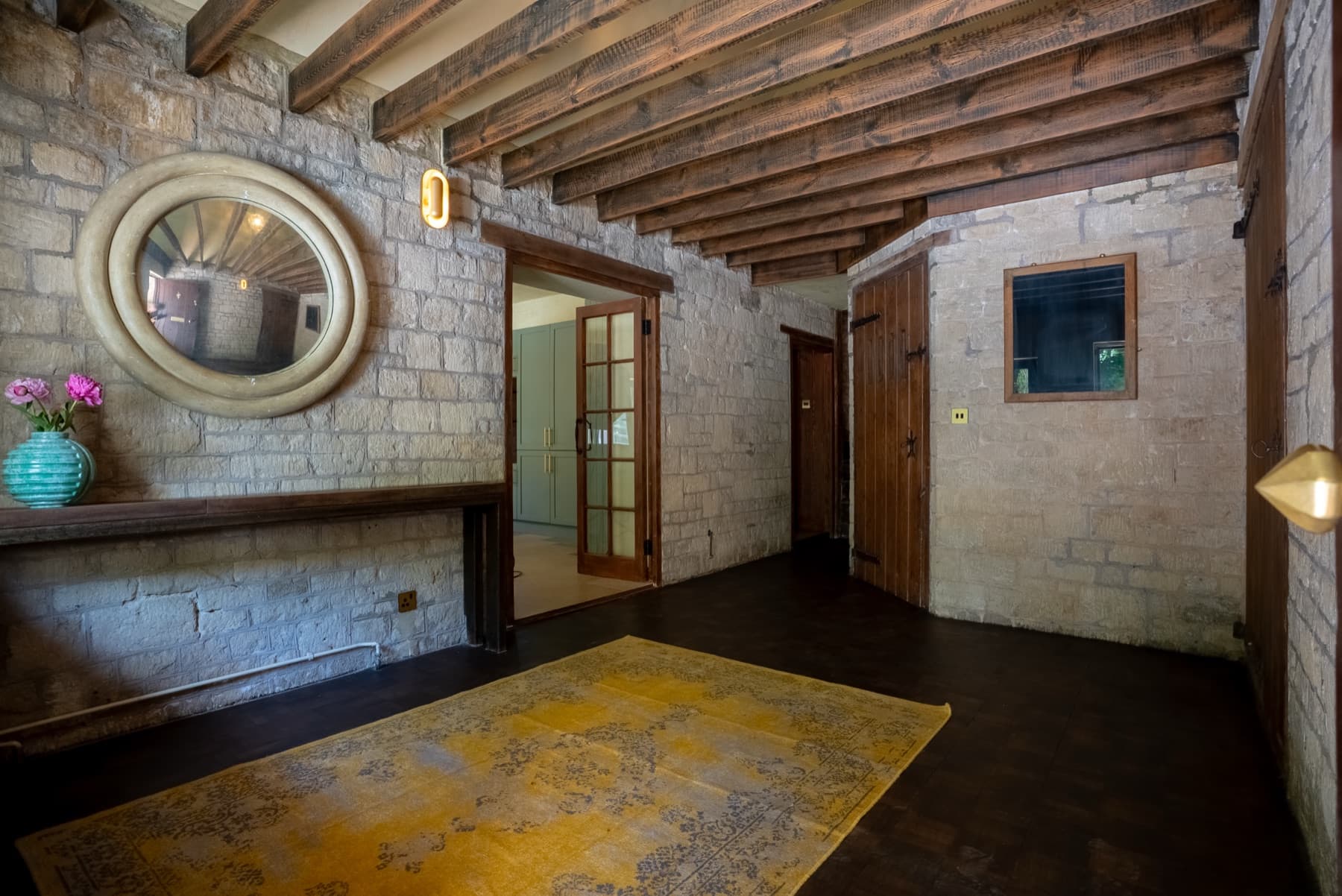 Stone-walled interior with antique mirror